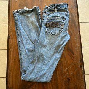 Cowgirl, tough. They have little ruffles on the bottom of the pants.